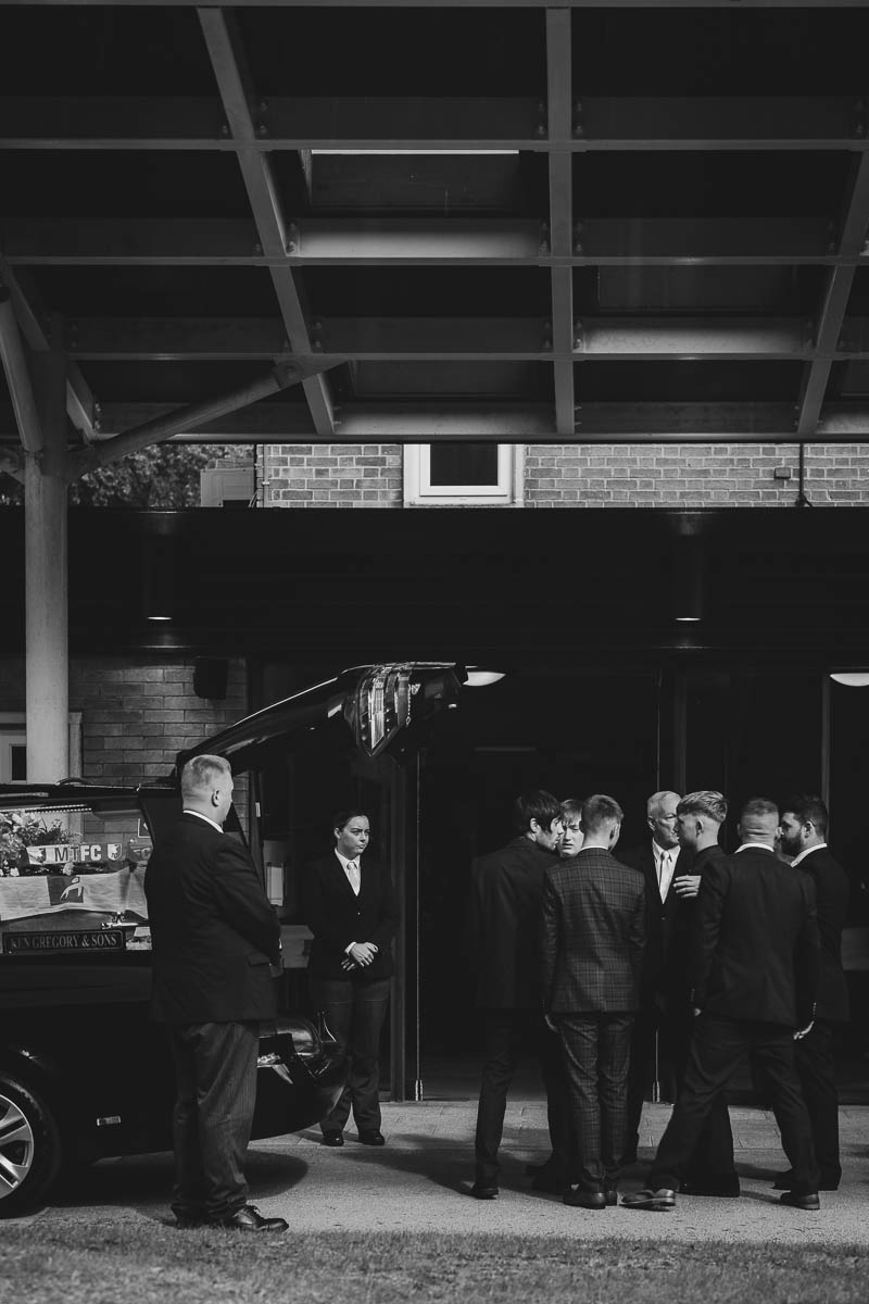 Family and friends standing outside of Crematorium