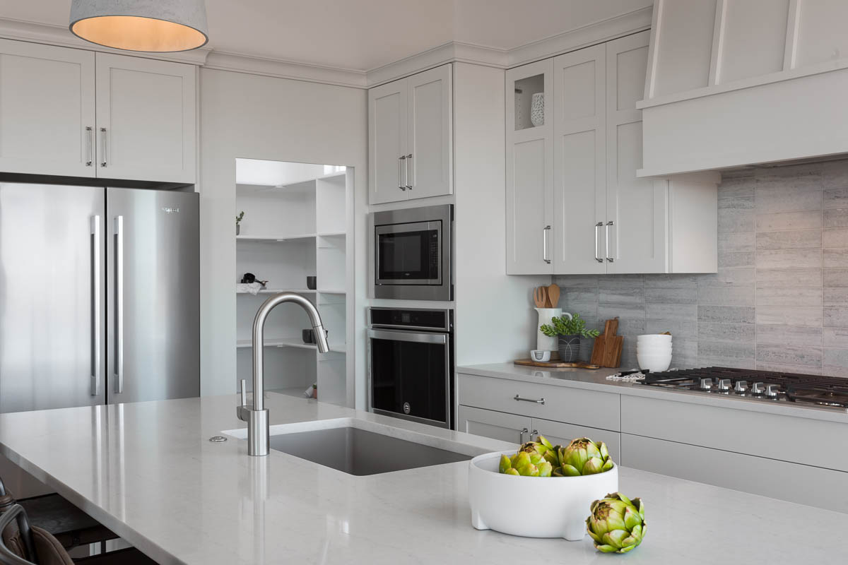 Kitchen and pantry with artichokes on kitchen counter top