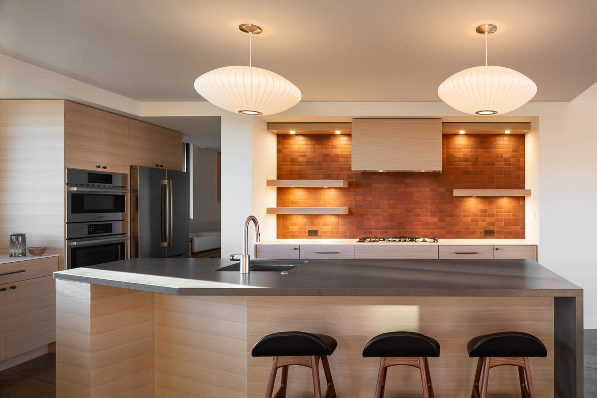 Kitchen with red tile and paper light shades