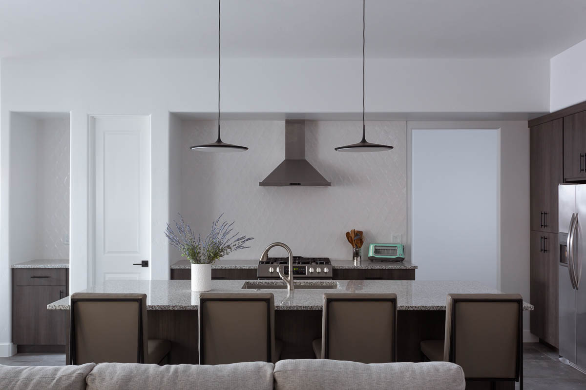 Kitchen with pale tones and stove hood