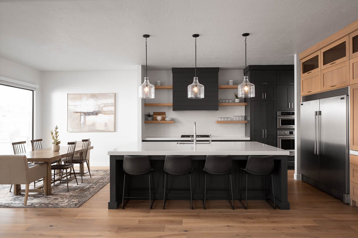 Dark blue kitchen island with frosted glass lighting