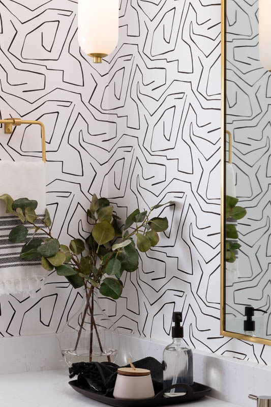 Bathroom wallpaper with light and green plant