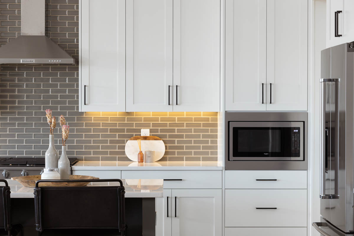 White kitchen cabinets and under cabinet lighting