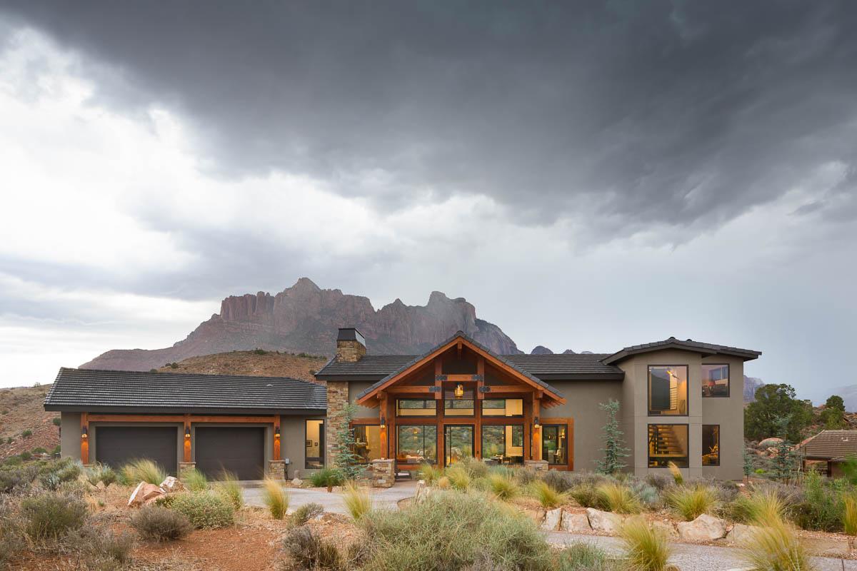 Open plan living room with large windows and view to mountains