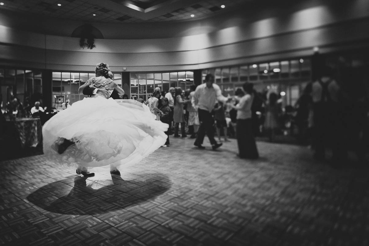 Wedding reception photograph of Bride and Groom dancing in great light